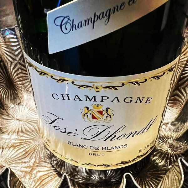 Bottle of Brut Champagne representing timeless elegance and unforgettable celebratory moments.