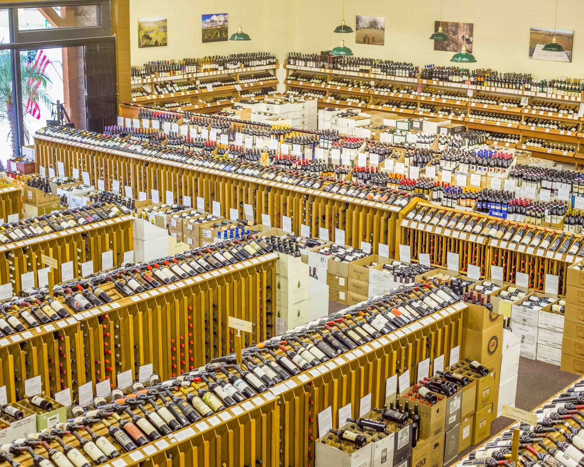 Aerial view of Woodland Hills Wine Company’s extensive wine inventory with racks of diverse bottles including Tempranillo wines.